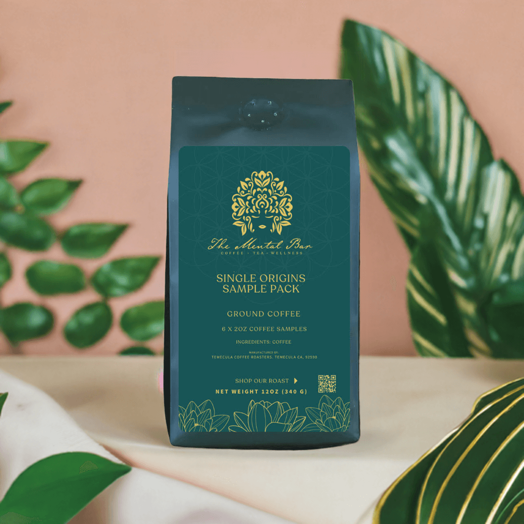 The Mental Bar Single Origin Coffee Sample Pack, featuring six 2-ounce coffee bags in a tropical setting.