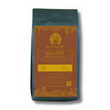 Encanto medium-dark roast coffee featuring caramelized apple, lemon, and caramel flavors.